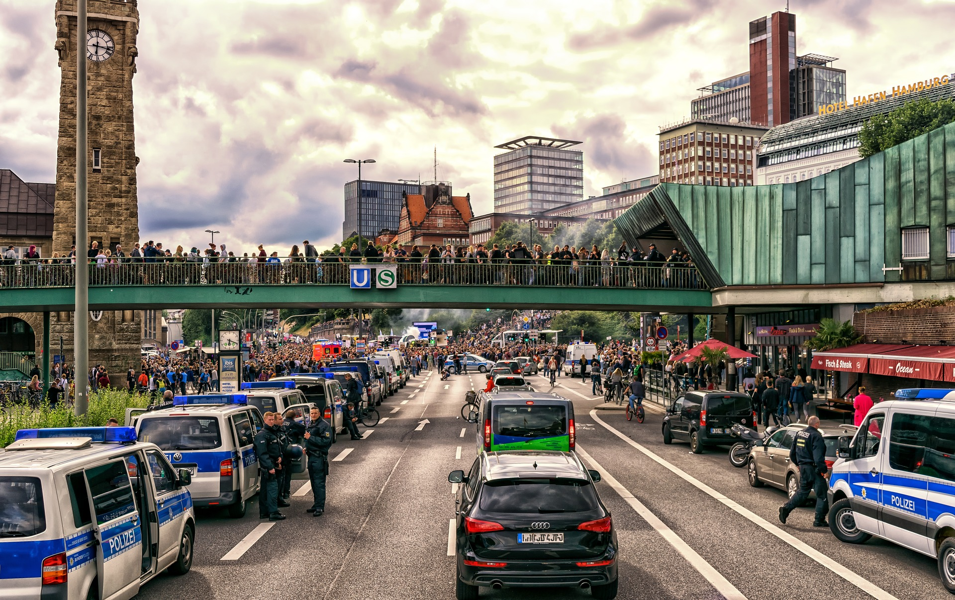 Climate activists demonstrate on top of a bridge over traffic.